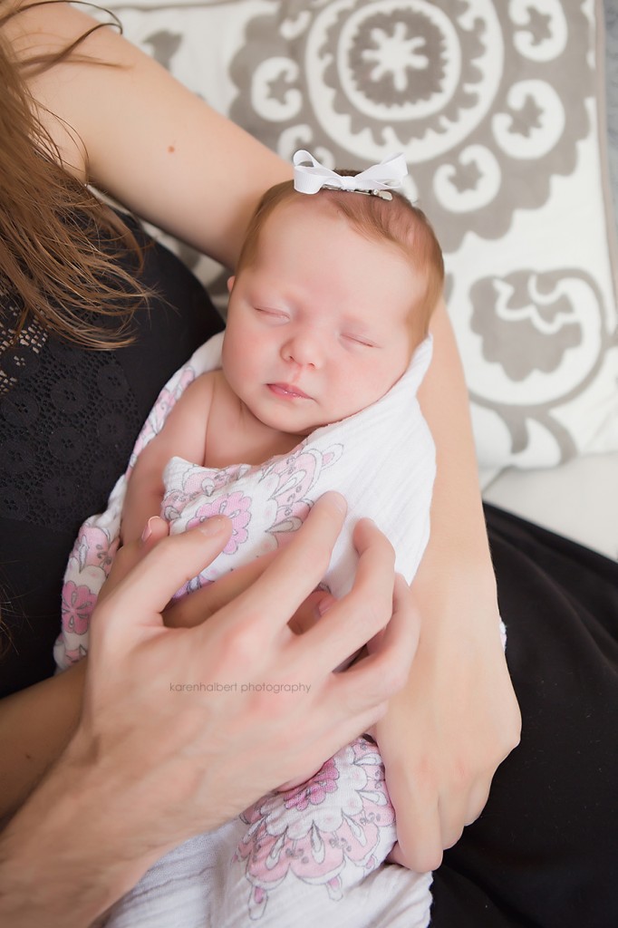 baby girl newborn holding hands